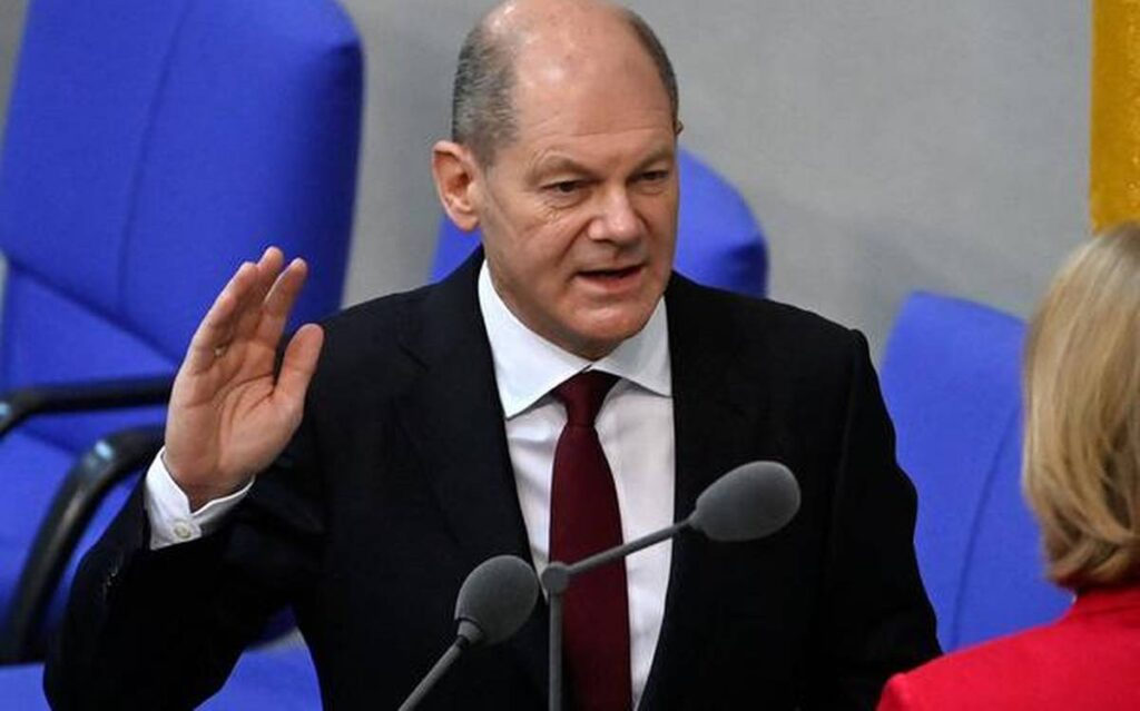 Olaf Scholz takes reins from Angela Merkel for new German era